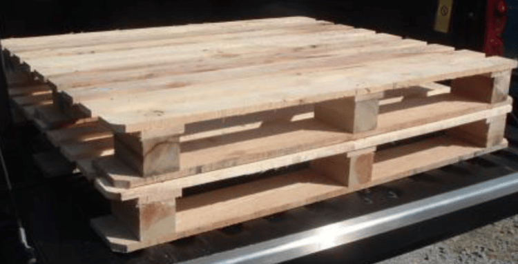 Two wooden block pallets stacked